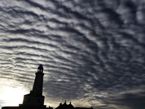 Altocumulus clouds above St Mary's Lighthouse in Whitley Bay, as an Arctic cold spell blowing in from the north looks set to cause temperatures to tumble.