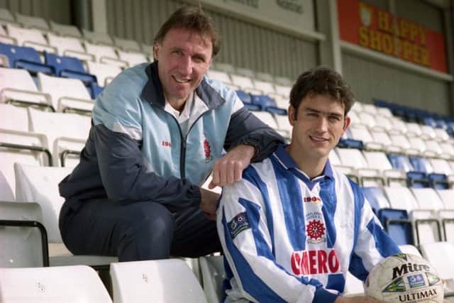 Paul Stephenson (right) signs for Hartlepool United.
