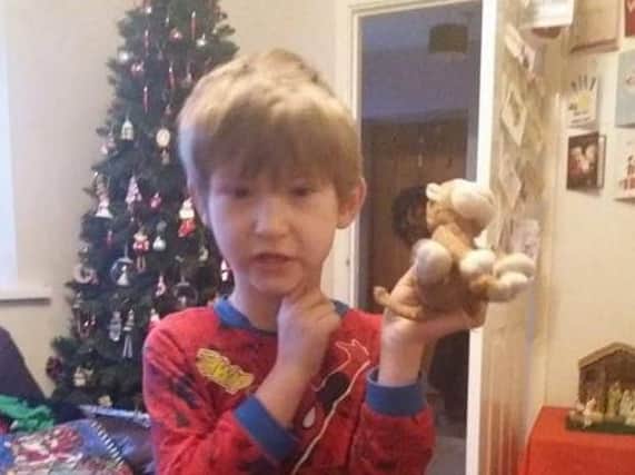 Five-year-old Thomas with Monkey back in his hands.
