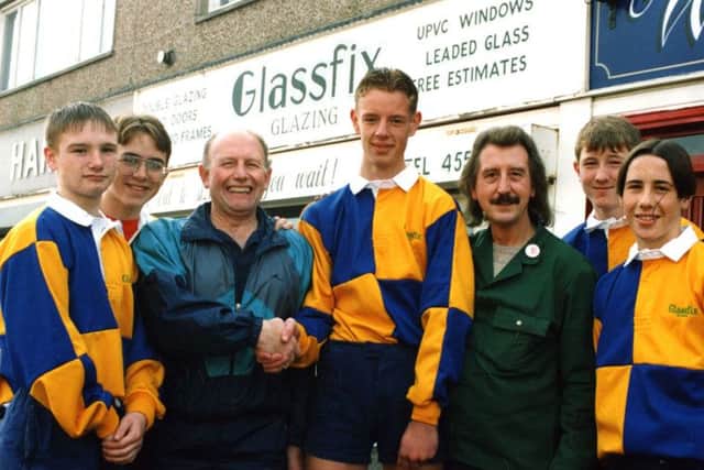 Memory Lane  December 1994  John Tighe and Michael Bates of Glassfix Glazing presenting rugby strips to Harton School rugby captain David Robson.