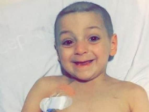 Bradley smiles as he begins to feel better following pain relief medication.