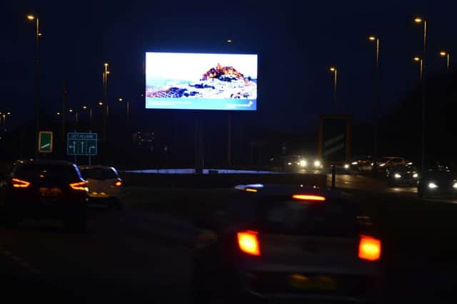 The Leam Lane advertising sign at night.