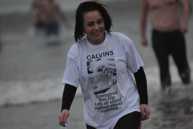 Stacie Pentland. Friends and family of Calvin Mclellan brave the chilly North Sea to raise funds for his family, after he was attacked last year.