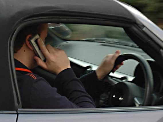 Almost 8,000 motorists were caught using a mobile phone while drivinglast year.