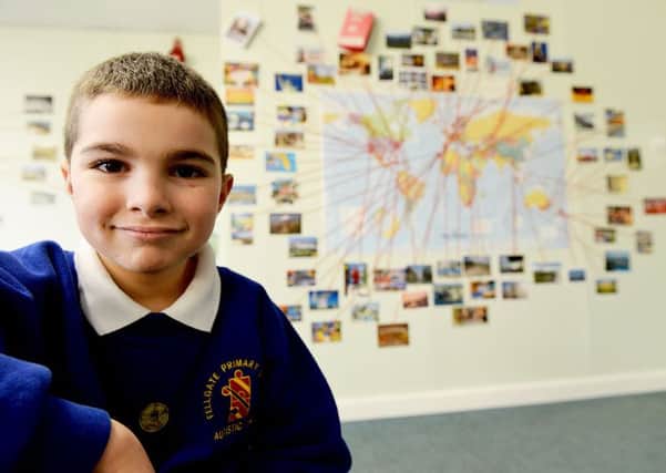 Matthew Mills in front of a section of his classroom wall that has a Postcard display on it at Fellgate Primary School Jarrow Picture by FRANK REID