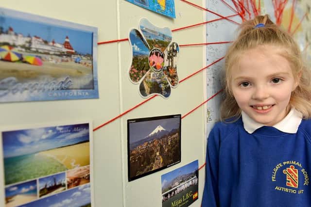 Olivia Kennon with postcards on a wall in her classroom classroom at Fellgate Primary School Jarrow Picture by FRANK REID