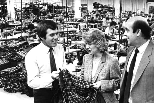 It's  March 1983  and pictured at  Barbour's factory are, left to right,  Dave Rennick (factory manager), Margaret Babour (Chairman) and Malcolm Sutherland (managing director).