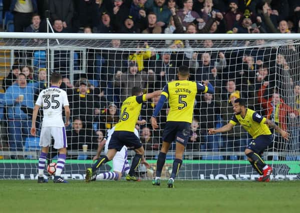 Kane Hemmings, right, pokes the ball home to give Oxford United a 1-0 lead against Newcastle United.