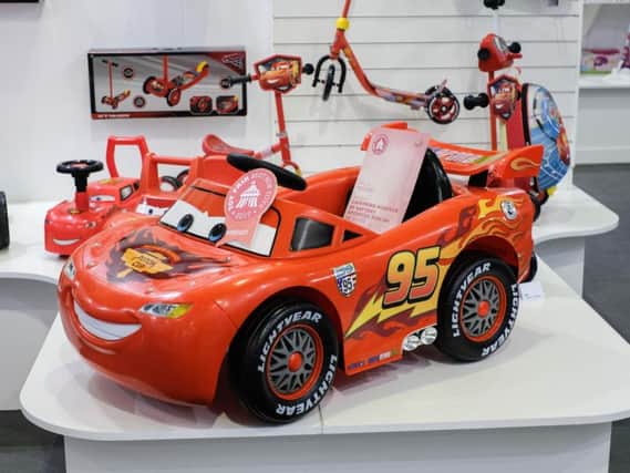 A ride-on replica of Cars' Lightning McQueen has been tipped as one of 2017's top toys - despite costing a whopping 200.