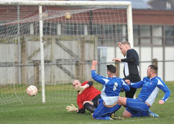 Jarrow FC (blue) in action against Boldon CA in the Wearside League, played at Perth Green CA, Jarrow. Photo by Tim Richardson.