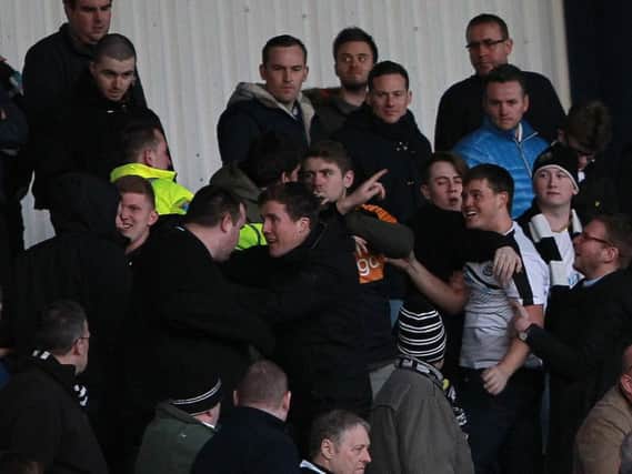 Angry NUFC fans in the Kassam Stadium terraces.