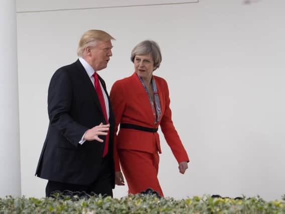 US President Donald Trump with British PM Theresa May, on her visit to Washington. Credit: PA