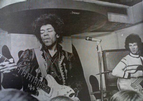 Jimi Hendrix performs at The New Cellar in one of the few existing photos from the gig