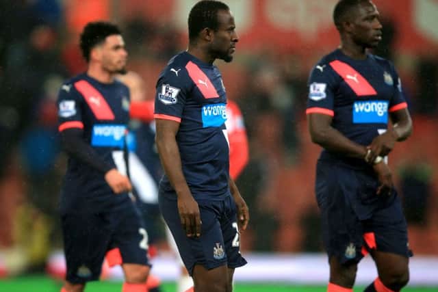 Seydou Doumbia, centre, after his near miss for Newcastle at Stoke. Picture: PA.