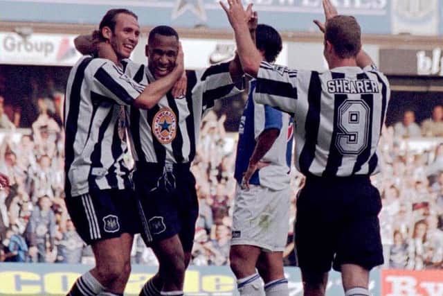 Les Ferdinand, second left, celebrates scoring for Newcastle with fellow Rangers old boy Darren Peacock, far left. Picture: PA.