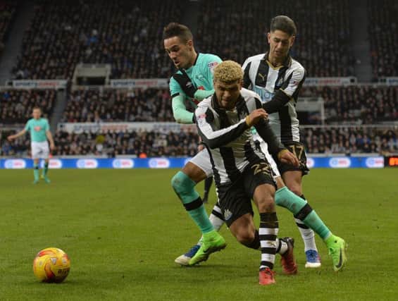 DeAndre Yedlin competes with Tom Ince