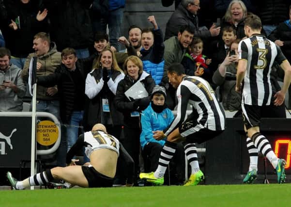 Newcastle fans show their delight as Jonjo Shelvey puts the Magpies ahead in the first minute against QPR on Wednesday. Picture by Frank Reid