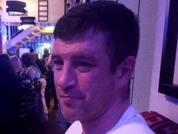 Police are investigating the circumstances of Andrew Hatton's death after his body was discovered in an alleyway.
