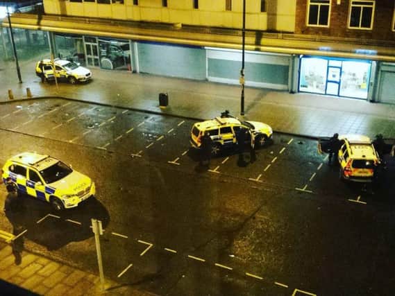 Police surround Coral bookmakers in Jarrow. Picture by Stephen Dixon.