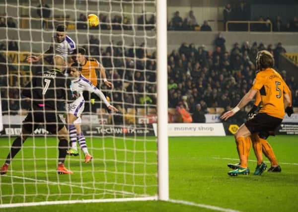 Newcastle Uniteds Jamaal Lascelles heads the ball towards goal.