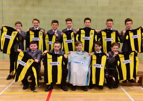Year 7 football team at St. Joseph's RC Comprehensive School, in their new strips.