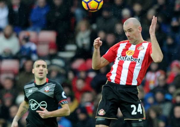 Darron Gibson rises to head clear against Southampton, watched by Saints Oriol Romeu. Picture by Frank Reid