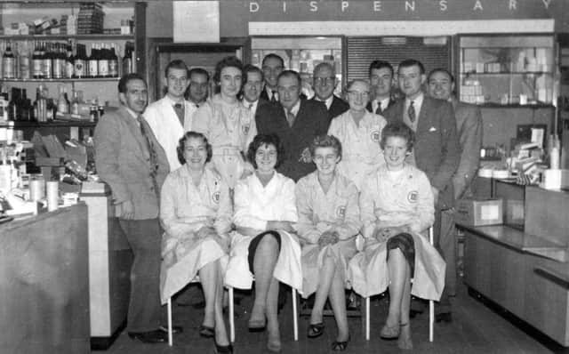 Staff at Masons the chemists, in King Street, in 1959.