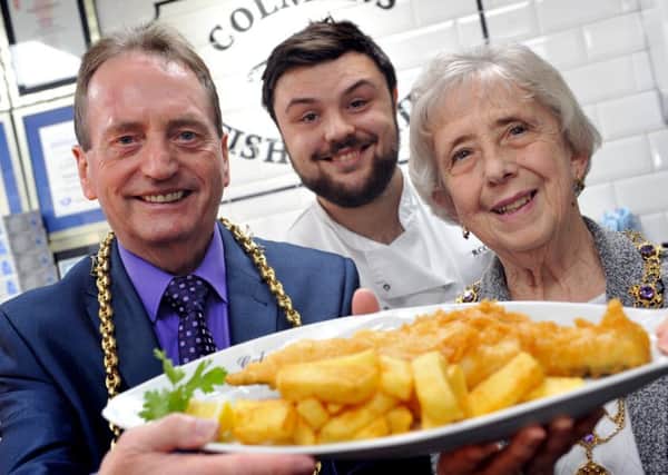 The Mayor Coun Alan Smith and Mayoress Coun Moira Smith are served fish and chips by Colman's Richard Ord Jnr. Picture by Tim Richardson