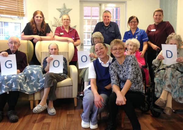 Staff and residents at Garden Hill celebrate their rating