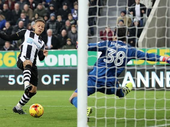 Dwight Gayle scores against Nottingham Forest earlier this season.
