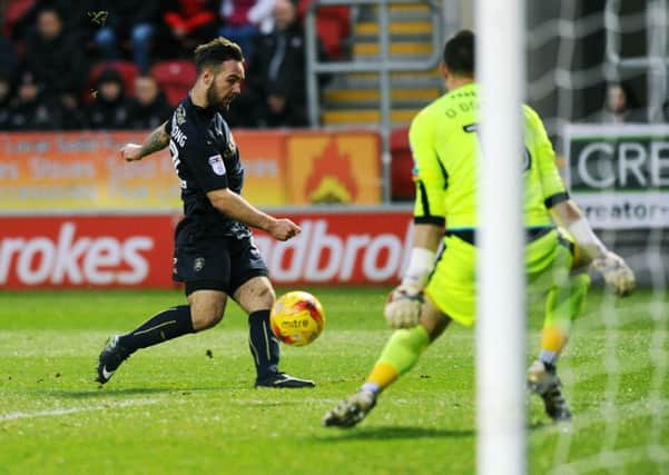 Adam Armstrong, on loan from Newcastle United, scores the winning goal for Barnsley against Rotherham United last month.