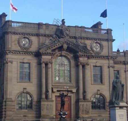 Flags at the Town Hall are flying at half mast.