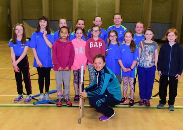 England Women cricketer Danielle Hazell with some of those who took part in her coaching session for girls at Harton Technolgy College, South Shields on Sunday.