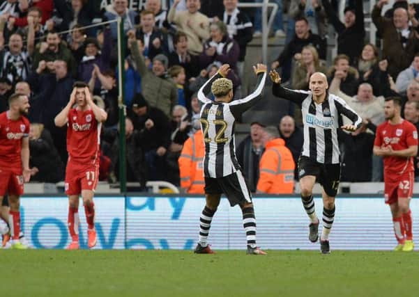 Newcastle Uniteds DeAndre Yedlin and Jonjo Shelvey celebrate after Bristol City score an own goal late on make the score 2-2.