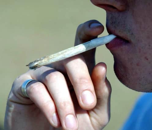 Man smoking a cannabis joint. Pic: PA.