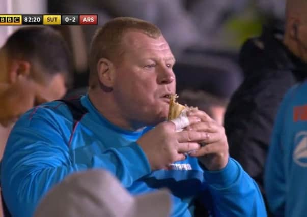 Wayne Shaw eating a pie during the game. Photo: BBC1