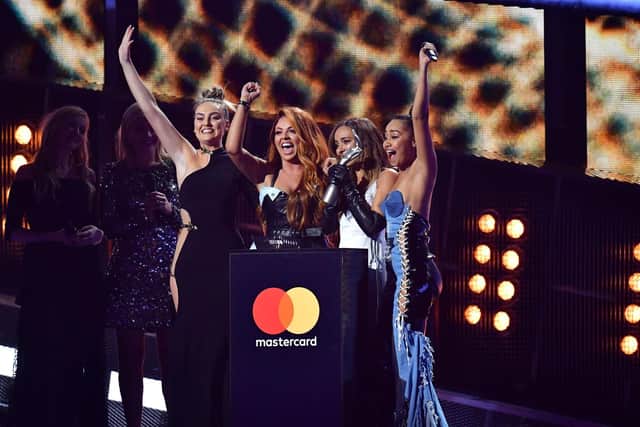 The girls collect their award at the Brits 2017 ceremony.