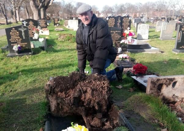 Tommy Oughton at the graveside of his wife Mary.