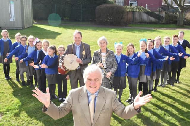 Ernest Young, musical director of the Bede Wind Orchestra, with the Mayor and Mayoress of South Tyneside and pupils from St Matthews RC Primary and Mortimer Primary choirs.