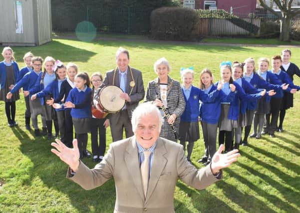 Ernest Young, musical director of the Bede Wind Orchestra, with the Mayor and Mayoress of South Tyneside and pupils from St Matthews RC Primary and Mortimer Primary choirs.