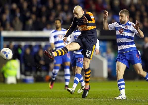 Jonjo Shelvey drives in a shot for Newcastle in last night's draw at Reading, as home defender Joey van den Berg looks on