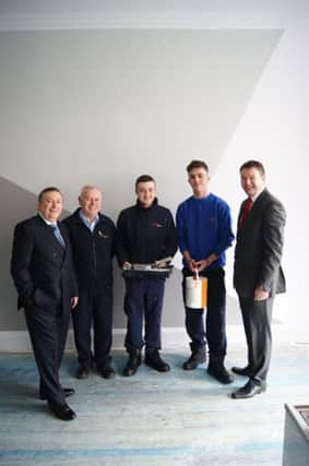 South Tyneside Homes apprentices Thomas Goodman, centre, and David Goodfellow, second right, with Coun Ed Malcom, left, Gary Broome, South Tyneside Homes team leader, and Andrew Watts, chief executive of Groundwork STAN, right, at Jarrow Hall House.