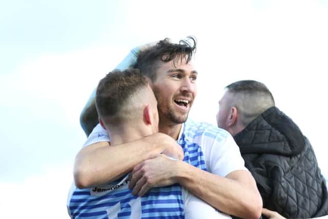 Carl Finnigan celebrates his goal in the fifth round win at Team Solent with team-mate David Foley. Image by Peter Talbot.