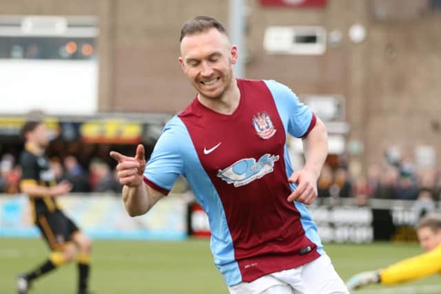 David Foley celebrates his early goal for South Shields against Morpeth Town in the fourth round. Image by Peter Talbot.
