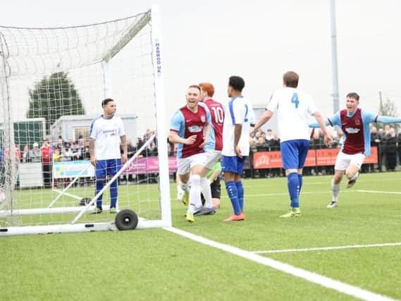 David Foley celebrates his goal at Coleshill. Image by Peter Talbot.
