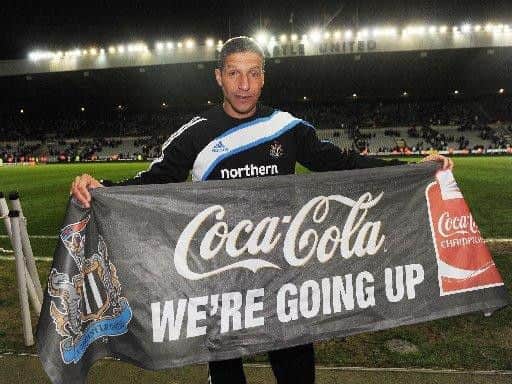 Chris Hughton celebrates Newcastle United's promotion back to the Premier League in 2010.