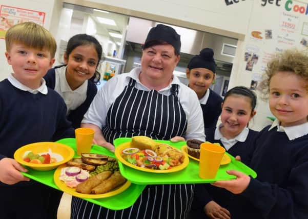 Stanhope Primary School cook Lynn Curtin ahead of International School Meals Day.
Children from left Cody Headley,4, Bisma Khawaja, 9, Jaspreet Singh, 9, Jessica Paul, 7 and Emily Kouhy