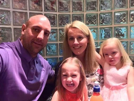 Lisa Kelly with partner Gavin and twin daughters Scarlett and Jasmine.