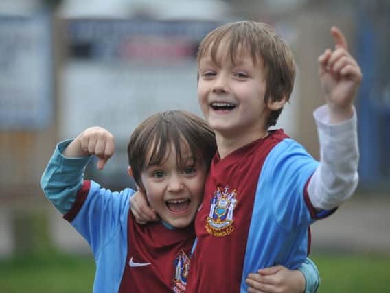South Shields FC supporters Jack and Max Shaw celebrating the club's FA Vase semi-final win.