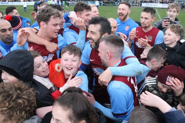 Barrie Smith, Julio Arca and the Shields players celebrate with fans at full-time
